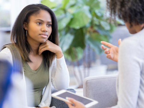 Adviser talking to student