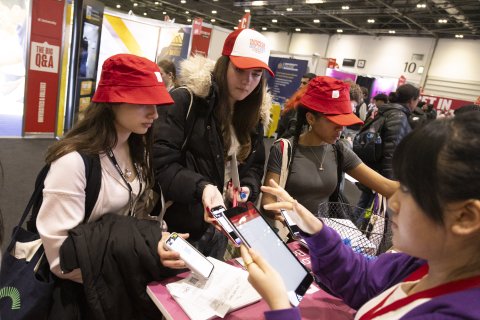 Students with Hat interacting