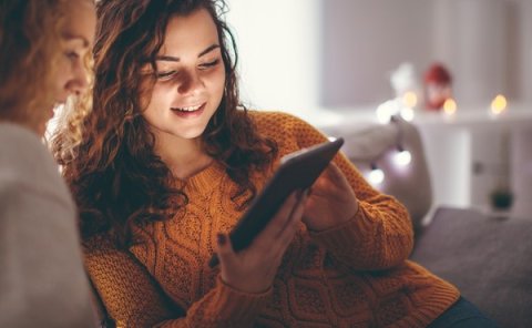 Parent and child checking UCAS deadlines online