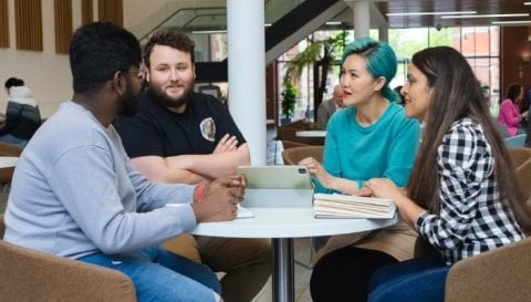 Students chatting in university communal area 