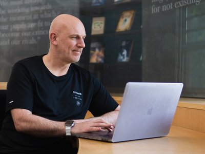 Adviser using laptop